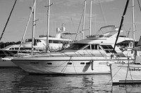 Yachts docking at marina. Free public domain CC0 photo.