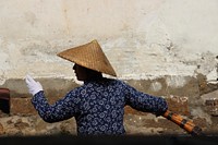 Chinese boatman, Zhouzhang, Jiangsu, China - March 25, 2015