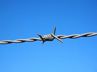 Barbed wire fence, security protection. Free public domain CC0 image