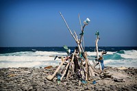 Trash piles on the beach. Free public domain CC0 photo.