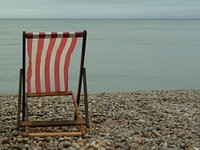 Empty white stripe beach chair. Free public domain CC0 photo.