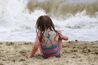 Little girl at beach. Free public domain CC0 photo.