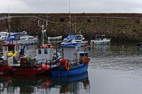 Wooden fishing boats at dock. Free public domain CC0 photo.