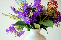 Purple flower arrangement in vase.  Free public domain CC0 image.