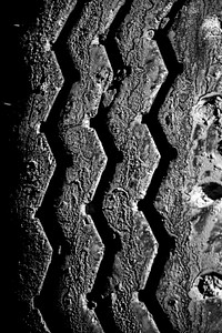 Close up car tire print on soil. Free public domain CC0 photo.