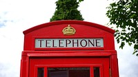 Iconic red phone booth in London, England. Free public domain CC0 photo.