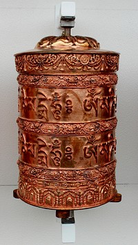 Buddhist copper wheel. Free public domain CC0 photo.