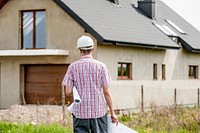 Engineer at house construction site. Free public domain CC0 photo.