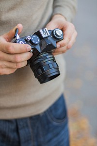 Photographer with analog camera. Free public domain CC0 image.