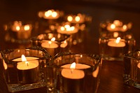 Lit candles, background photo. Free public domain CC0 image.