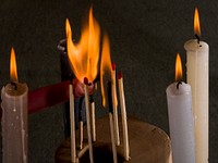 Lighting candles, background photo. Free public domain CC0 image.