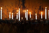 Lit candles, background photo. Free public domain CC0 image.