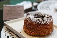 Donut with icing sugar. Free public domain CC0 photo.