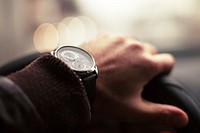 Wristwatch on arm, timepiece. Free public domain CC0 photo.