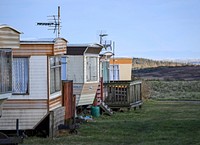 Hut near hill. Free public domain CC0 photo.