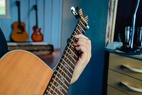 Musician playing guitar, music background.Free public domain CC0 photo.