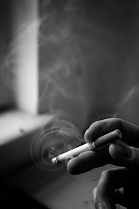 Man smoking, bw image. Free public domain CC0 photo.