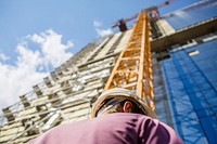 Builder at construction site. Free public domain CC0 photo.