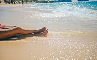 Tanning on the beach, background photo. Free public domain CC0 image.