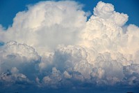 Blue sky background with clouds. Free public domain CC0 photo.