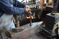 Farrier in workshop. Free public domain CC0 photo.