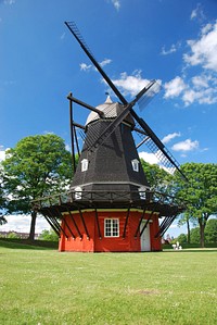 Rustic windmill building in the countryside. Free public domain CC0 image.