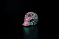 Halloween human skull decoration on black background. Free public domain CC0 image.