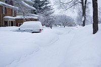 Neighbourhood covered in snow during winter. Free public domain CC0 photo.