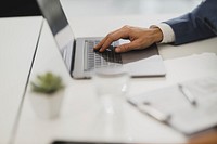 Free close up of businessman hand typing on laptop at the office desk image, public domain CC0 photo.