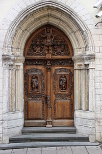 Old arched wooden door. Free public domain CC0 photo.