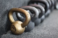 Kettlebells on gym floor. Free public domain CC0 photo.