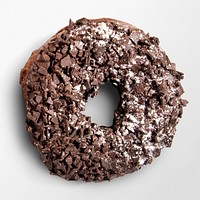 Shredded chocolate ring donut on white background, food photography