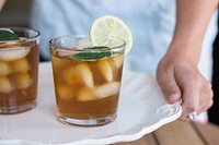 Free ice lemon tea tray, woman hands, mint, lemon photo, public domain beverage CC0 image.