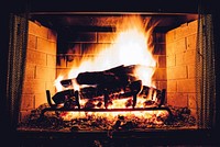 Burning log in a fireplace. Free public domain CC0 photo.