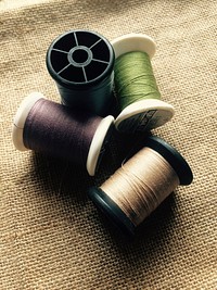 Thread on spools. Free public domain CC0 photo.