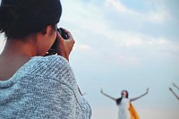 Woman photographer with dancer in the blur background