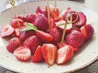 Free strawberries cut in half on plate image, public domain fruit CC0 photo.