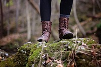 Free boot on moss rock closeup image, public domain human CC0 photo.