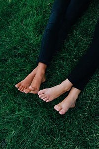 Feet in green grass. Free public domain CC0 photo.