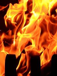 Burning fire, orange background. Free public domain CC0 image.