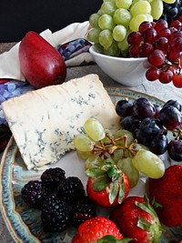 Plate of cheese and fruit. Free public domain CC0 photo.