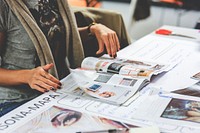 Woman reading magazines. Free public domain CC0 photo.