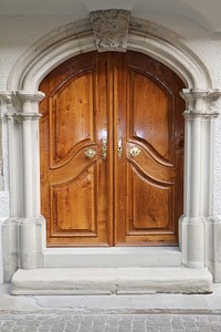 Old arched wooden door. Free public domain CC0 photo.