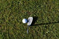 Closeup on golf club head and ball. Free public domain CC0 image. 