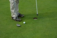 Golfer putting, background photo. Free public domain CC0 image.