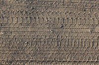 Dry wheel track on dirt soil texture. Free public domain CC0 photo.