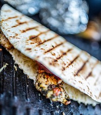 Closeup on chicken Quesadilla on grill. Free public domain CC0 image.