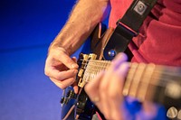 Musician playing guitar, music background.Free public domain CC0 photo.