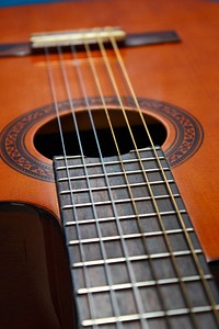 Beautiful acoustic guitar, musical instrument background. Free public domain CC0 photo.