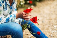 Woman and poppy flower. Free public domain CC0 image.